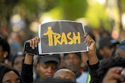 A protester during the march against gender-based violence in  Sandton last week raises  her feelings about men  through her placard. /  Gallo Images/ Alet Pretorius