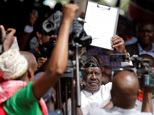 Raila Odinga, leader of the Opposition's National Super Alliance, reacts during his inauguration as the people's president at Uhuru Park in Nairobi, January 30, 2018. /Reuters