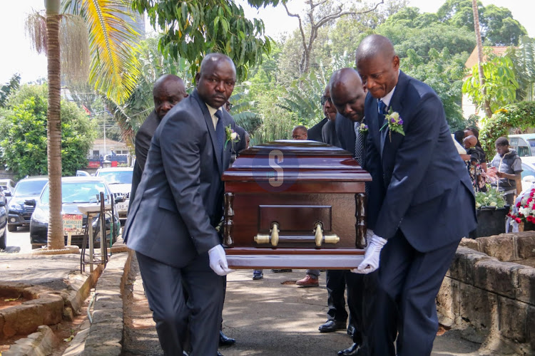 Men carry the casket of former Commissioner General of Kenya Prisons Isaiah at Maxwell SDA on January 17.