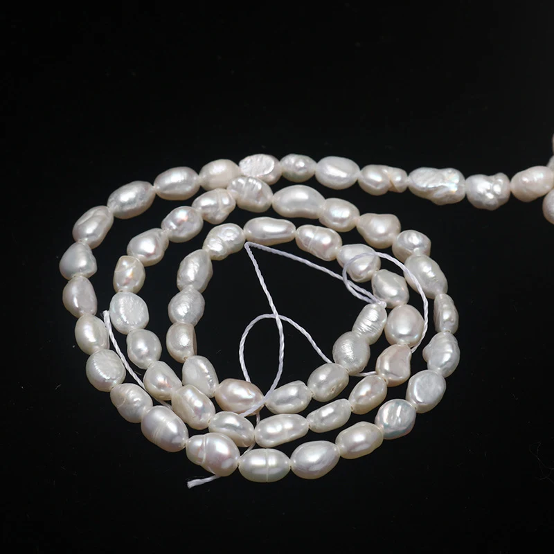 Perlas de agua dulce naturales de 5-6 mm con fuerte brillo. Perfectas para crear joyas elegantes y duraderas, realzando tu belleza.