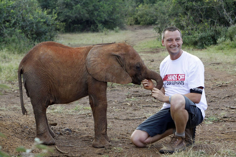 Geoff Mayes poses with an elephant