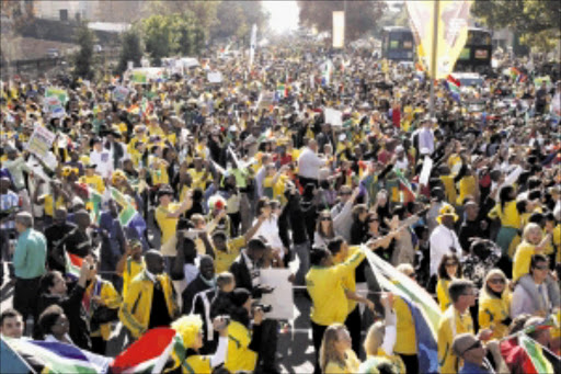 viva: Bafana Bafana fans came in great numbers to cheer their national team during a parade at Sandton City on Wednesday, just two days before their opening match against Mexico in the first World Cup on the African continent. PHOTO: ANTONIO MUCHAVE. 10/06/2010. © Sowetan.