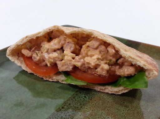 Healthy chicken salad served on 1/2 pocket thin with tomato and lettuce 7 points plus