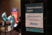 A motivational sign is seen inside a coronavirus disease (Covid-19) vaccination clinic at the Bankstown Sports Club during a lockdown to curb an outbreak of cases in Sydney, Australia, August 25, 2021.   