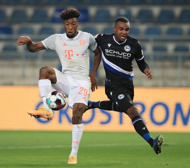 Bayern Munich's Kingsley Coman in action with Arminia Bielefeld's Nathan de Medina