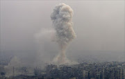 Smoke rises after air strikes on rebel-controlled besieged eastern Aleppo, Syria.