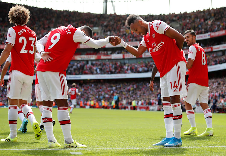 Arsenal's Pierre-Emerick Aubameyang celebrates scoring their second goal with teammate Alexandre Lacazette during a 2-1 Premier League win over Burnley at the Emirates Stadium in London on August 17 2019.