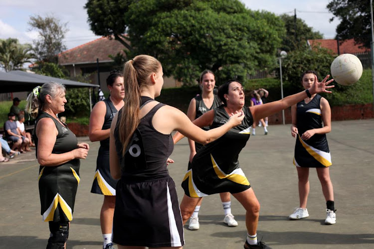 South Coast A1 ringball tTeam ladies practising on the courts of Toti High before the start of a game.