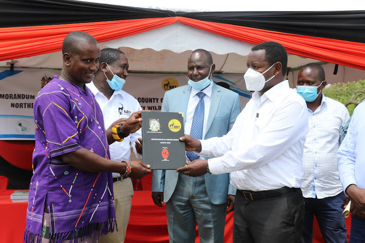 Kalepo Conservancy chair Alois Lepakiyo, NRT CEO Tom Lalampaa, CEC Tourism Peter Leshakwet and Samburu Governor Moses Lenolkulal.