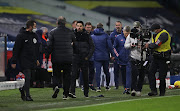 Marcelo Bielsa, Manager of Leeds United(2L) and Mikel Arteta, Manager of Arsenal(3L) embrace at the final whistle during the Premier League match between Leeds United and Arsenal at Elland Road on November 22, 2020 in Leeds, England.  