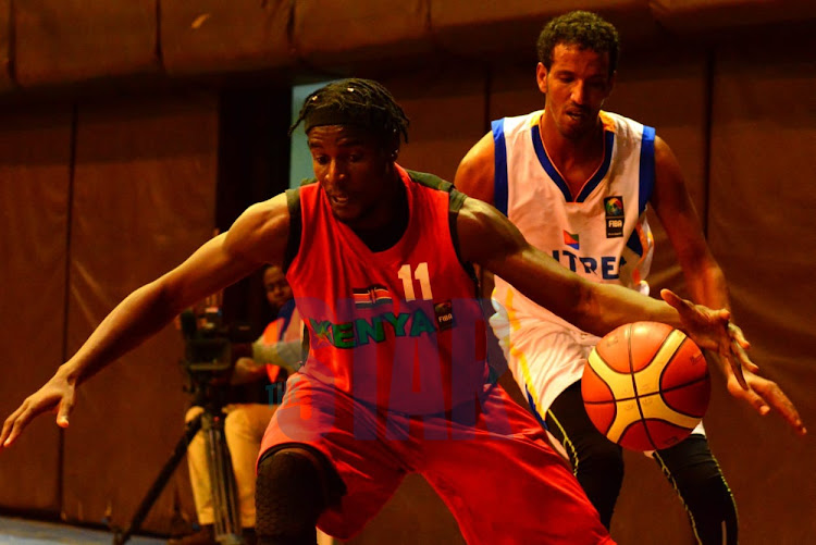 Kenya's Valentine Nyakundi shields the ball from Andom Abebe of Eritrea at the Nyayo National Stadium on Tuesday, January 14, 2020.