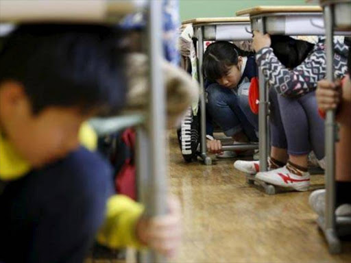 Students sheltering during Japan earthquake. Photo/COURTESY