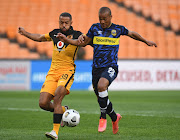 Reeve Frosler of Kaizer Chiefs challenges Fagrie Lakay of Cape Town City during the DStv Premiership 2020/21 match between Kaizer Chiefs and Cape Town City on the 21 April 2021 at FNB Stadium.