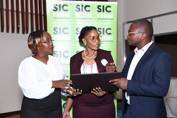 Safaricom Investment Co-operative outgoing CEO Sarah Wahogo, Board Chairperson Judy Runo and Acting CEO Stephen Mbugua during the Society’s 15th Annual General Meeting where shareholders approved a Sh142.4 million rebate payout.