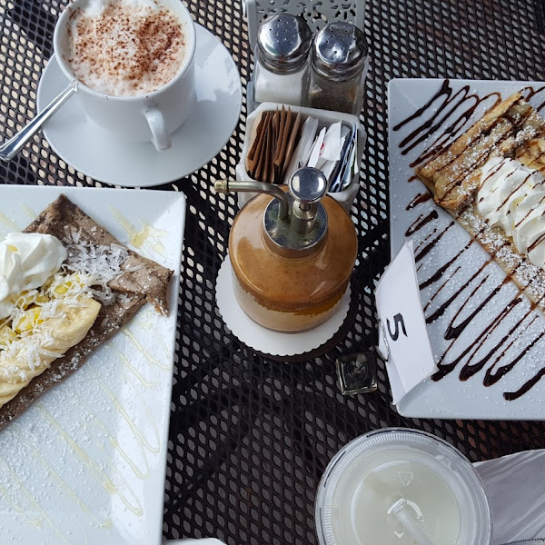 On the left, gluten free French Polynesian Crepe. On the right, gluten-full crepe with  banana with nutella.