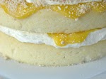 Lemon Cake with Creamy Filling and Lemon Curd was pinched from <a href="http://www.shugarysweets.com/2013/03/lemon-cake-with-creamy-filling-and-lemon-curd" target="_blank">www.shugarysweets.com.</a>