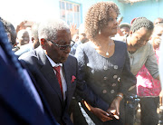 Dust engulfs former Zimbabwean president Robert Mugabe and his wife Grace as they arrive to vote in the general elections in Harare, Zimbabwe on July 30 2018.