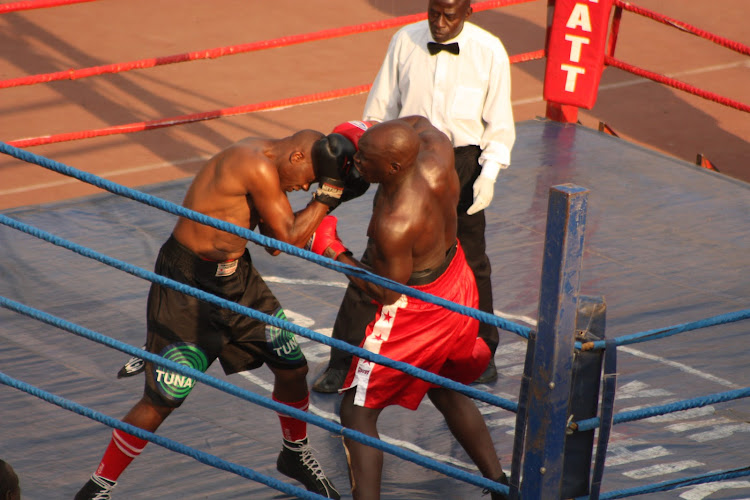 Raymond 'Kingkong ' Ochieng lands a punch on James Nyariki din a past match