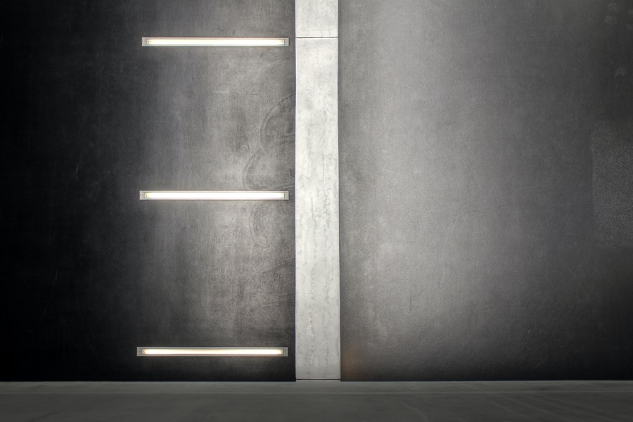 Linear wall sconces for interior and exterior spaces