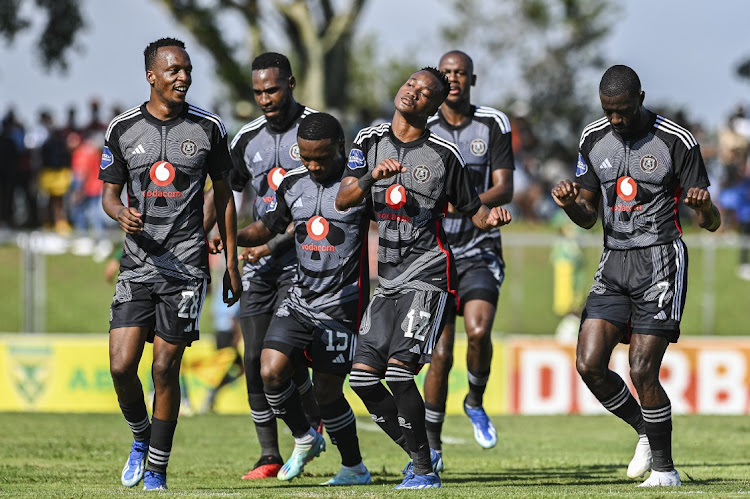 Orlando Pirates' Patrick Maswanganyi, left, celebrates scoring with teammates during the DStv Premiership match against Lamontville Golden Arrows at Mpumalanga Stadium in Hammarsdale on Sunday.