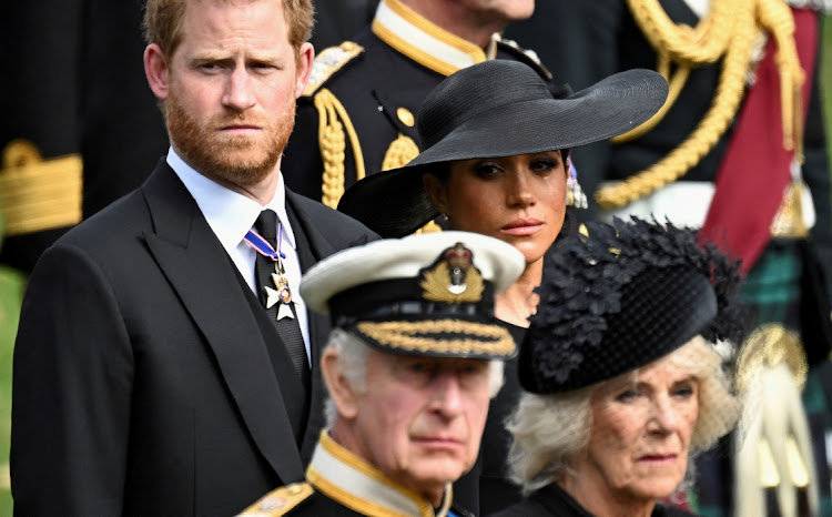 The Duke and Duchess of Sussex, Prince Harry and Meghan, pictured here at the Queen's funeral, appear to be taking aim at the royal family as part two of their docuseries airs this week. File image.