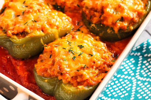 Italian Sausage and Rice Stuffed Peppers with melted cheese.