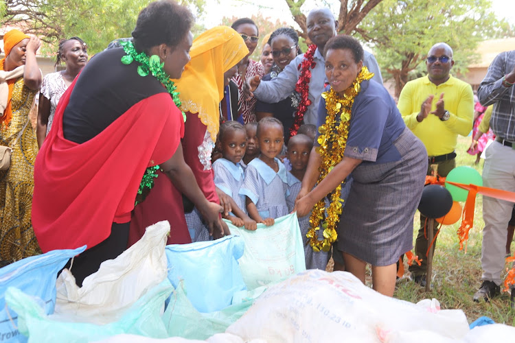 Taita Taveta County Education, Libraries and Vocational Training Centres CEC Gloria Monikombo and Deputy Governor Christine Kilalo during the launch of ECDE feeding program on March 13