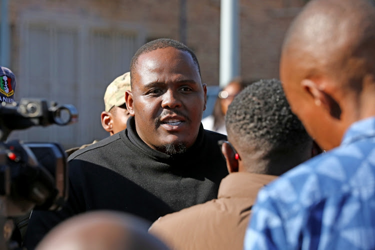 Vhatuka Mbelengwa from Soweto United E-hailing Association talks to the media after a meeting with taxi owners and municipal officials in Soweto.