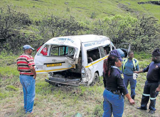 TRAUMATIC EVENTS: A taxi driver travelling from the Western Cape to Qumbu, towing a trailer with a coffin, was killed on the R56 between Elliot and Ugie on Saturday when he lost control of the vehicle. Nine passengers were injured and the corpse was flung from the coffin Picture: LULAMILE FENI