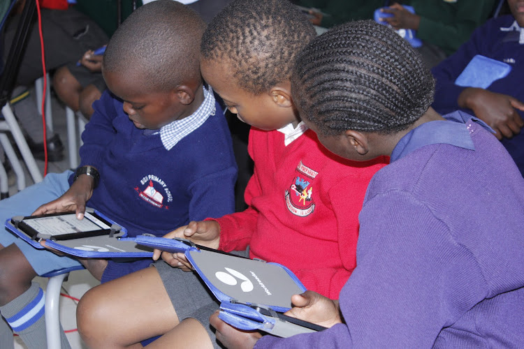 Pupils enjoying digital learning.