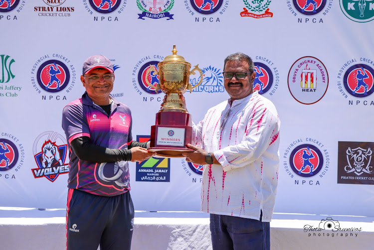 Ngara Sports Club B captain Piyushkumar Patel receives the NPCA Division 2 T-20 Floating Trophy from NPCA chairman Sreenivas Thota,