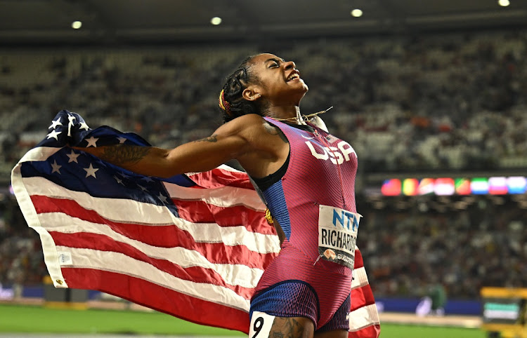 Sha'carri Richardson of the US celebrates winning gold in the 100m at the World Athletics Championship at the National Athletics Centre in Budapest, Hungary Monday night.