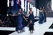 Television personality Ntando Duma and her daughter Sbahle Mlungu stole the show while modelling Khosi Nkosi designs at African Fashion International Joburg Fashion Week.