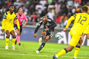 Zakhele Lepasa scores for Orlando Pirates while Thato Mokeke of Cape Town City looks on in their DStv Premiership match at Orlando Stadium on Tuesday night.