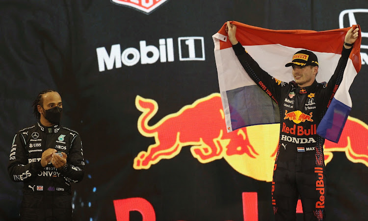 Red Bull's Max Verstappen took his first Formula One title, denying rival Lewis Hamilton a record eighth.