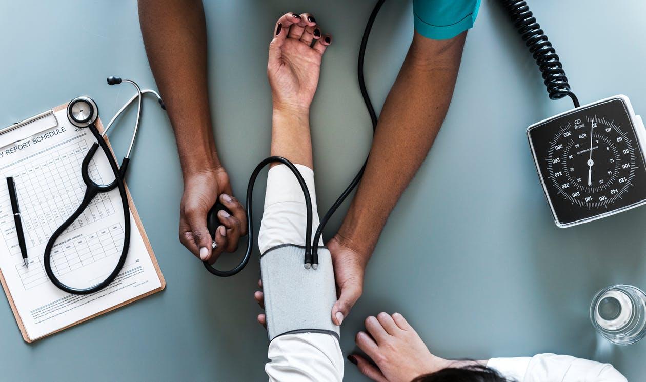 Person Using Black Blood Pressure Monitor