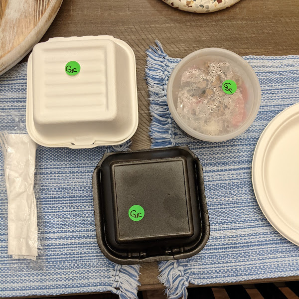 GF dishes for takeout marked with a green sticker and placed in a separate bag