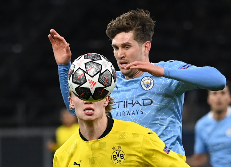 Borussia Dortmund's Erling Braut Haaland fights for the ball with Manchester City's John Stones in their Champions League quarter-final, second leg at Signal Iduna Park, Dortmund on April 14, 2021