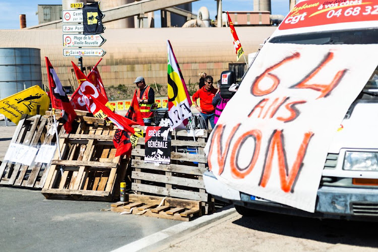 Striking members of the General Confederation of Labour (CGT) union block an access road to the EPPLN oil depot in Port La Nouvelle, France, on Wednesday, March 22, 2023.