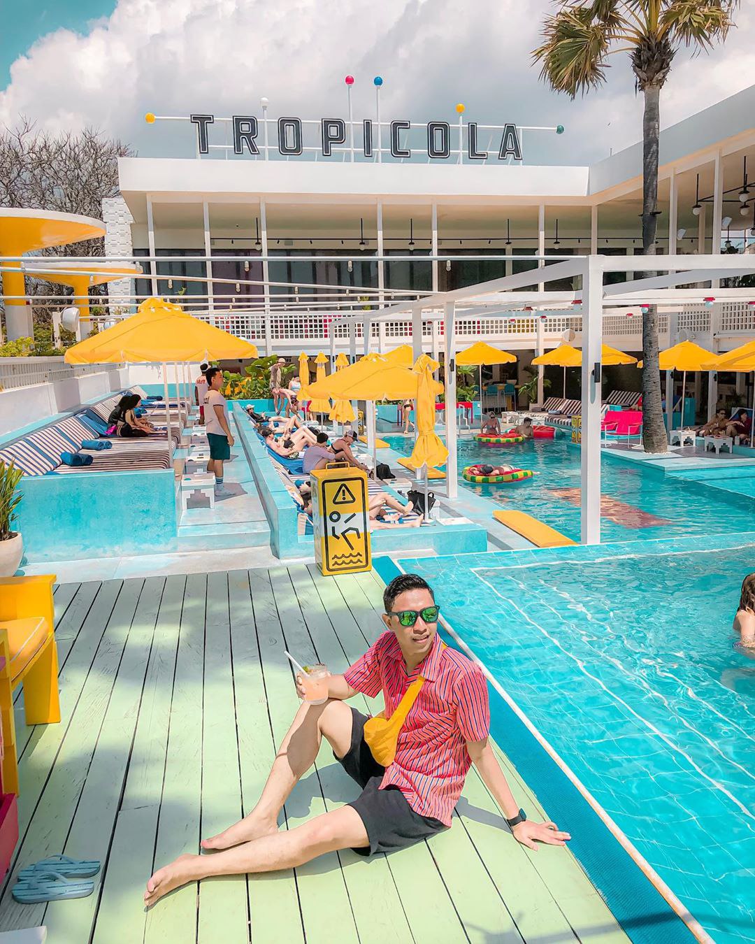 Get an instagrammable shot by the water at Tropicola Beach Club Bali