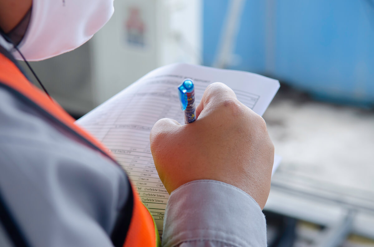 Personnel working through a checklist