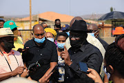 Police minister Bheki Cele visits the family of slain Tshwane councillor Tshepo Motaung at their Mabopane home on Tuesday.