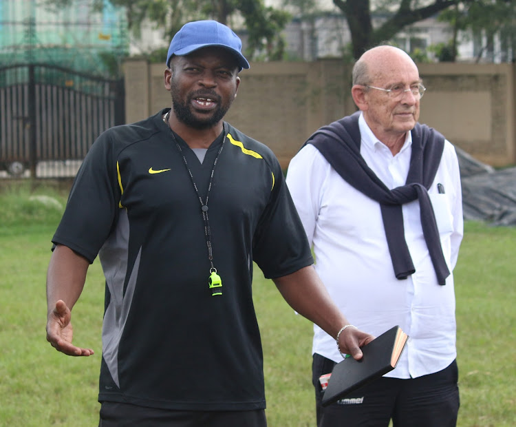 Mathare's new coach Frank Ouna with club chairman Bob Munro on Tuesday.