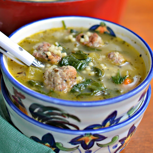 Italian Wedding Soup is made with delicious pork and beef meatballs, onions, carrots, celery, garlic, spinach and pasta in a deliciously seasoned broth.