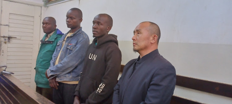 WANG ZHANGYI ,Emmanuel Kipkogei Limo, David Ipomai Orodi and Joseph Mutuku Masaka at the Kibera court