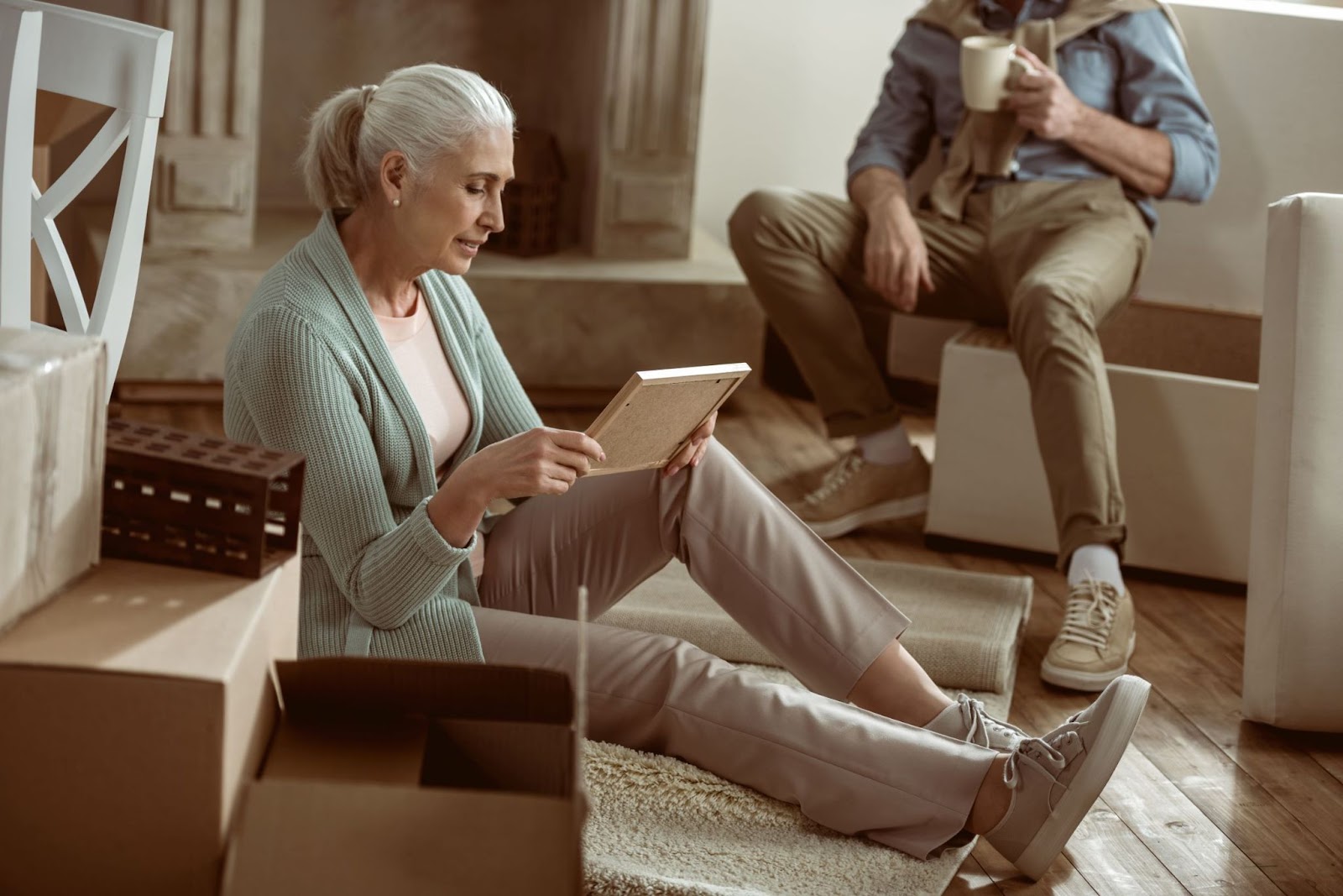 senior-man-and-woman-sorting-through-photographs