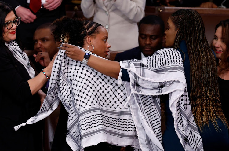 US Representatives Rashida Tlaib (D-MI), Cori Bush (D-MO) and Summer Lee (D-PA) put on Palestinian keffiyehs prior to US President Joe Biden's State of the Union address at the US Capitol in Washington, D.C., US March 7, 2024.