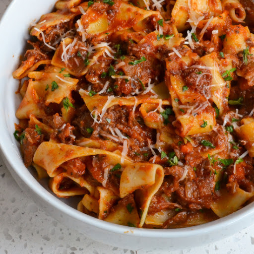 A slow cooked Beef Ragu recipe combines a sofrito made with onions, celery, carrots, garlic, tomatoes, and herbs mixed with tender melt in your mouth beef roast.