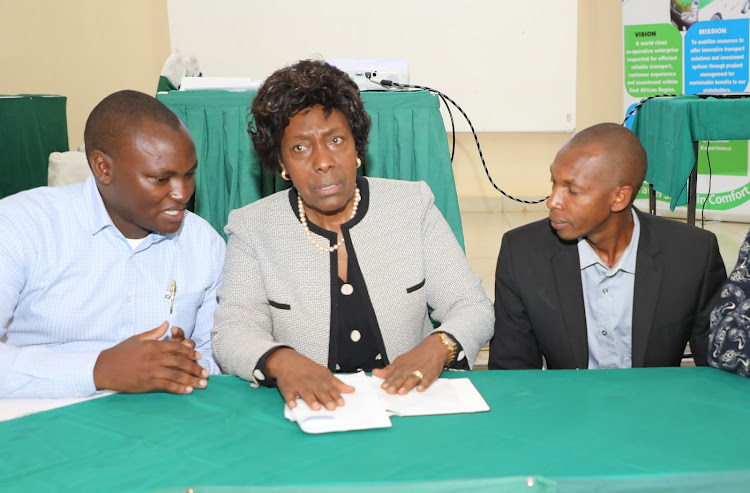 Kinatwa Sacco chairman Clinton Wambua, Kitui governor Charity Ngilu and Sacco secretary Charles Mbondo on Saturday