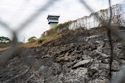 A burnt area is pictured at the Regional de Guayaquil prison after unrest was reported since the country's worst-ever riots broke out a few days ago at the Penitenciaria del Litoral, in Guayaquil, Ecuador, October 3, 2021. 